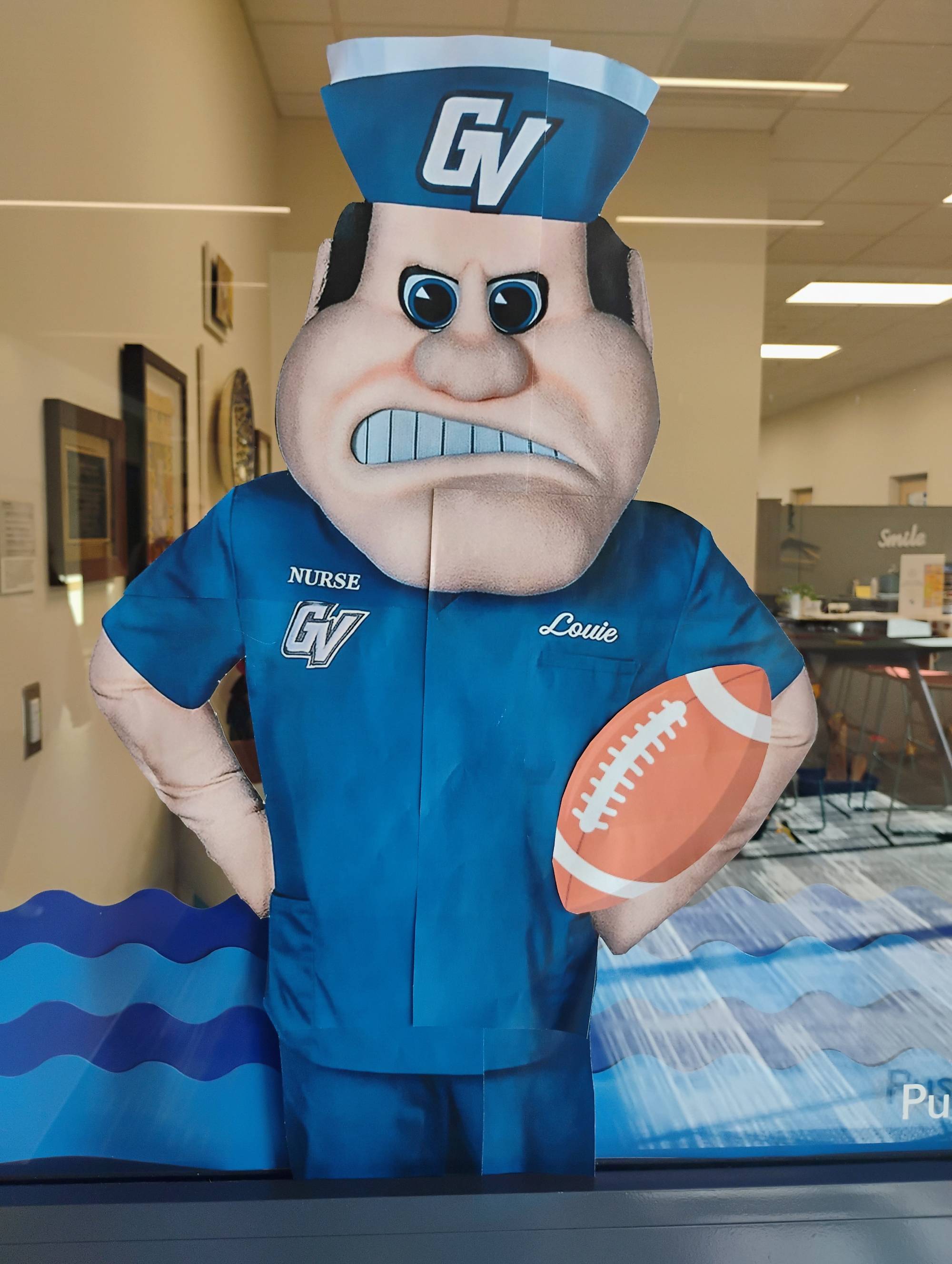 KCON Homecoming decorations, close up of Louie wearing scrubs